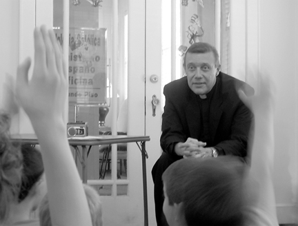 Father Richard D. Harris answered a wide variety of questions from a group of home-schooled children during a recent vocations talk he gave at St. Joseph Church in Columbia.