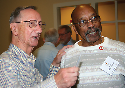 Retired Deacon Paul F. Shook of Spartanburg, left, talks with Deacon James H. Johnson of St. Ann Church in Florence during a break between workshops at the Diaconate Fall Day of Education in Columbia on Oct. 17.