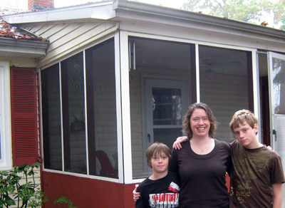 Melissa Drummond and her sons, Isaac, left, and Alexander, stand in front of their home, which is part of the Laurens Electric cooperative’s “Help My House” program. The family won $10,000 in home upgrades for energy efficiency.