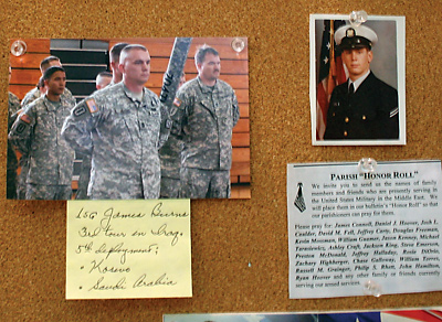 Pictures, names and prayers are tacked on a wall of honor for military personnel at Corpus Christi Church in Lexington. Families can post images of loved ones who are deployed or serving in the armed forces, or take red, white and blue rosaries for prayer.