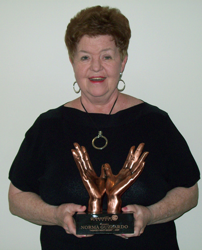Norma Guzzardo is pictured with the 2009 Heroes Next Door Award, which she won for volunteer work in Greenville. It was presented to her Nov. 5.