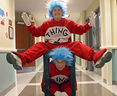 Ginny Mirabella, top, and Susan Smith, assistant kindergarten teachers at St. Gregory the Great School in Bluffton, dress up as classic Dr. Seuss characters Thing 1 and Thing 2