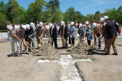 Msgr. Chester M. Moczydlowski, Bishop Emeritus David B. Thompson, architects and members of St. Benedict Church break ground for the dedication of a new parish campus in Mount Pleasant on April 11.