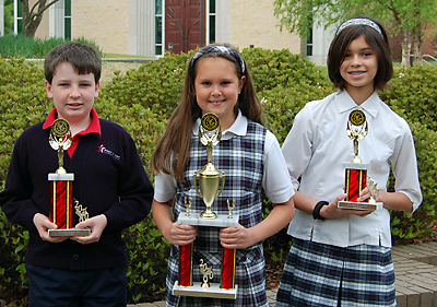 Prince of Peace School students James Christian, Alexis Fritz and Alyx Farkas are pictured with their science trophies.