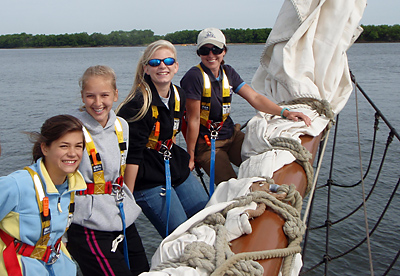 Charleston Catholic School students sit on the bow of the Spirt of South Carolina during a recent trip.