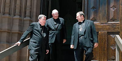 Bishops Robert J. Baker, David B. Thompson and Robert E. Guglielmone talk on the steps of the Cathedral of St. John the Baptist after the rededication celebration May 1. (Miscellany/Doug Deas)
