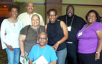 Arusi marriage ministry speakers Terri and Andrew Lyke, top left, with Joe Robinson, Gretta Barnes, Tonya LeSane, Michelle Robinson, and Msgr. Walter Barrett, kneeling, attended the Institutes held before the Archbishop James Patterson Lyke Conference. (Provided/Pam Harris)
