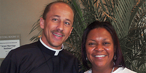 Father R. Tony Ricard stands with Pam Harris during the Archbishop James Patterson Lyke Conference held in North Charleston. Father Ricard was one of the featured speakers. (Provided/Pam Harris)