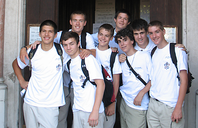 Will Victor, Aaron Kirby, Will Connor Frei, Patrick Judd, Matthew Ross, Nick Adams, Mark Tisler and Ian DeMass stand in front of a church in Rome as part of the Father Kolbe Vocations Pilgrimage. The club spent 11 days in Europe during June. (Photo Provided)