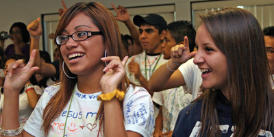 Teenagers sing and gesture during the Search for Christian Maturity retreat held at Camp Kinard from Sept. 3-5. (Miscellany/Christina Lee Knauss)
