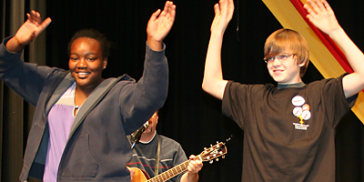 (Miscellany/Christina Lee Knauss) Audience volunteers dance onstage during a musical number at the Diocese of Charleston’s junior high youth rally at White Oak Conference Center Nov. 6. The youth moved to music by keynote speakers Shannon Cerneka and Orin Johnson of Oddwalk Ministries.