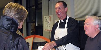 (Miscellany/Terry Cregar) Father H. Gregory West, administrator of St. Andrew Church in Clemson, serves some of his gumbo at the eighth annual Ministers’ Cook-Off recently.