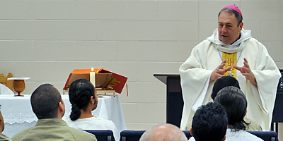 (Miscellany/Christna Lee Knauss) Bishop Robert E. Guglielmone celebrated Mass at the Federal Correctional Institution in Williamsburg on Dec. 24.